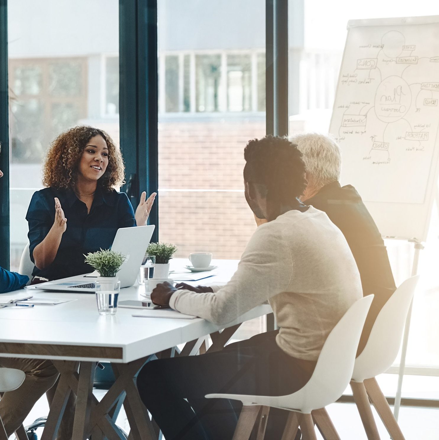Planning, teamwork and meeting with business people in boardroom for strategy, brainstorming and solution. Corporate, collaboration and conference with employees in office for negotiation development